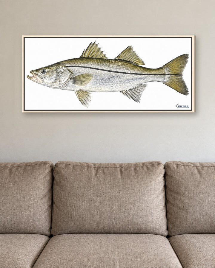 0.75in canvas in a Natural Wood floating frame, at true size above a sofa