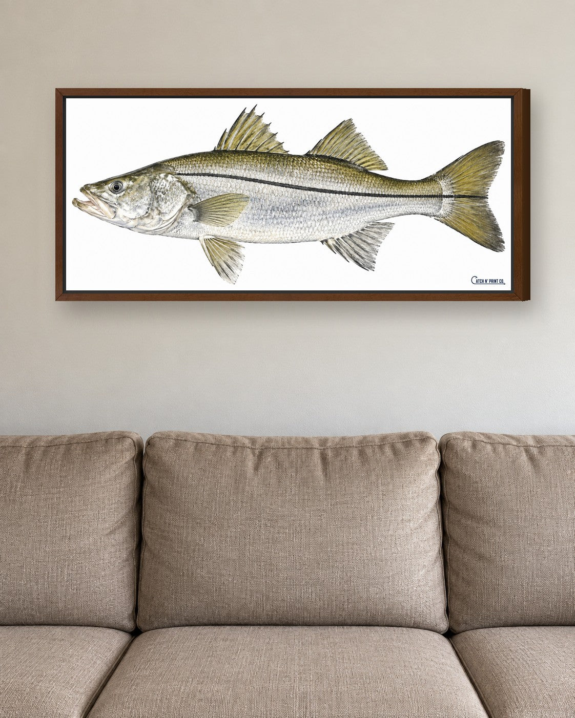 1.25in canvas in a Walnut floating frame, at true size above a sofa