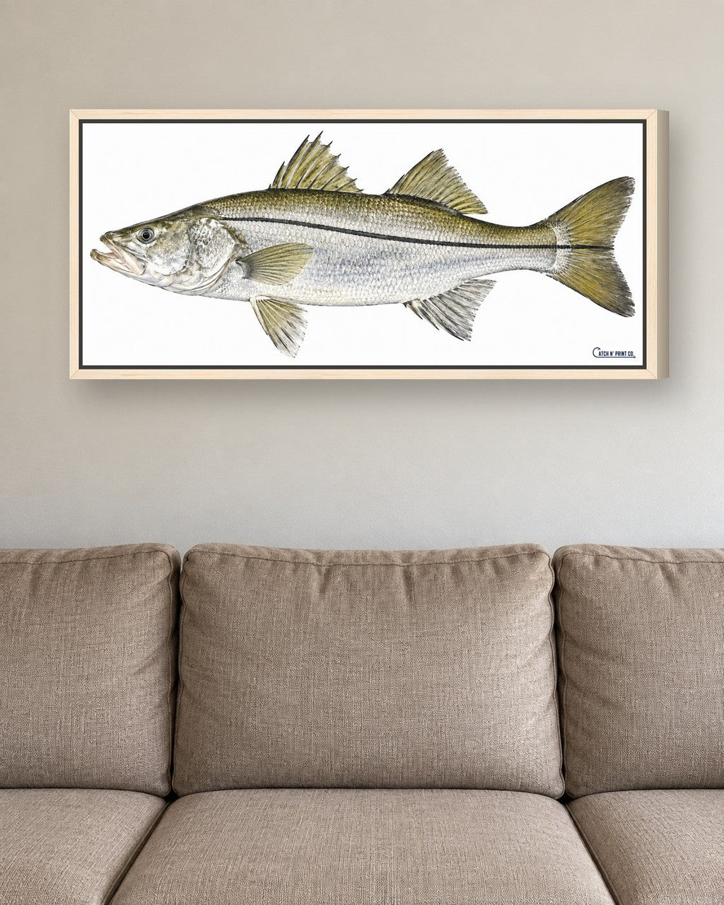 1.50in canvas in a Maple Wood floating frame, at true size above a sofa