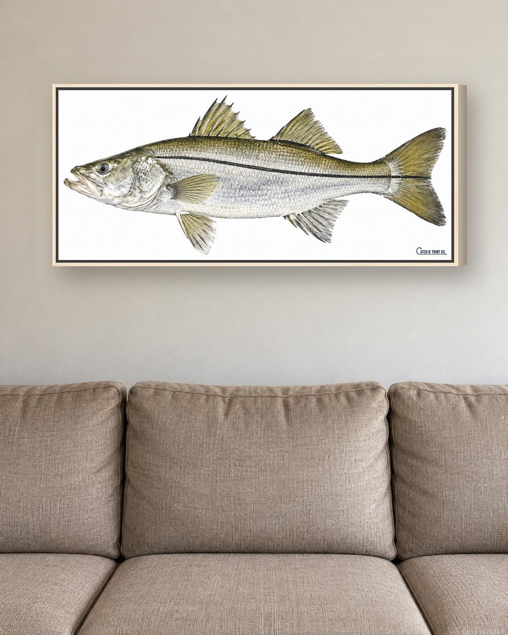 1.50in canvas in a Natural Wood floating frame, at true size above a sofa
