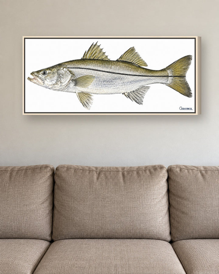1.50in canvas in a Natural Wood floating frame, at true size above a sofa