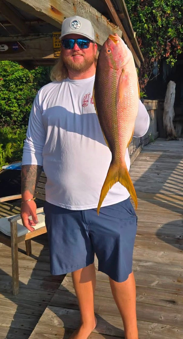 A real customer's yellowtail snapper catch, the reference for the artwork shown throughout this page